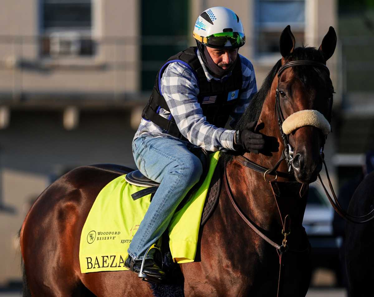 Rider Frankie Herrarte pats 2025 Kentucky Derby contender Baeza while waiting to go on the track for a work out on Oaks Day at Churchill Downs May 2, 2025 in Louisville, Kentucky. Trained by John Shirreffs, Baeza is 1-2-0 in four starts. Odds are 12-1.  