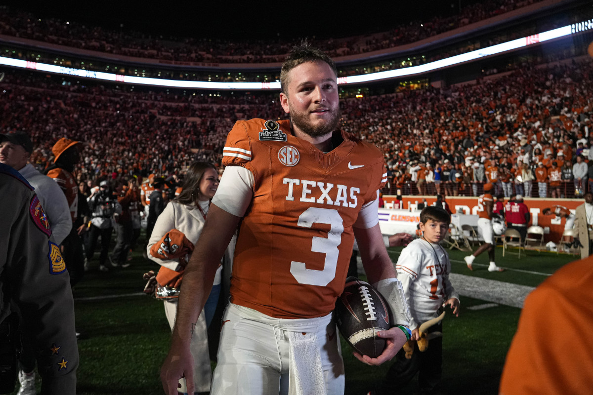 Texas Longhorns quarterback Quinn Ewers (3) leaves the field after defeating the Clemson Tigers in the first round of the College Football Playoffs at Darrell K Royal-Texas Memorial Stadium.