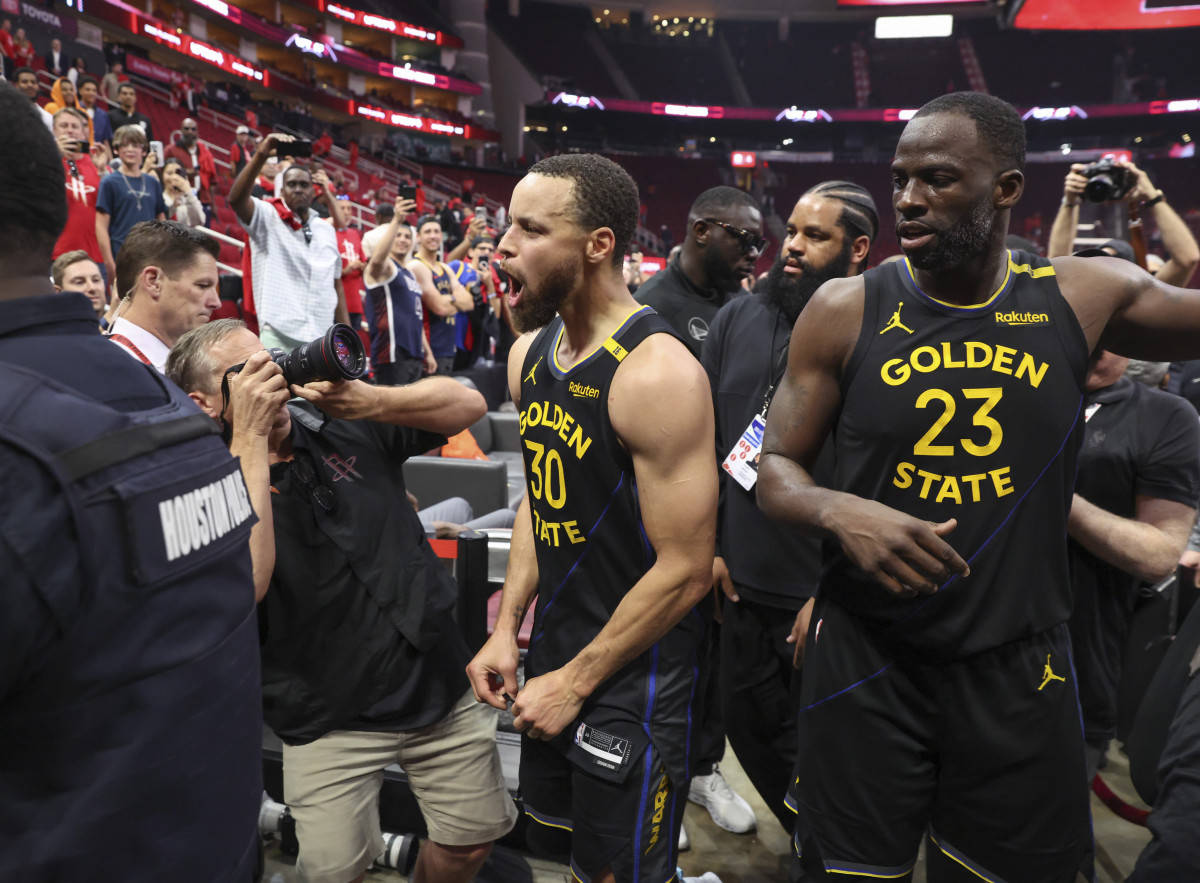 Golden State Warriors guard Stephen Curry (30) and forward Draymond Green (23) walk off the court after game seven of the first round for the 2025 NBA Playoffs against the Houston Rockets at Toyota Center. Mandatory Credit: Troy Taormina-Imagn Images