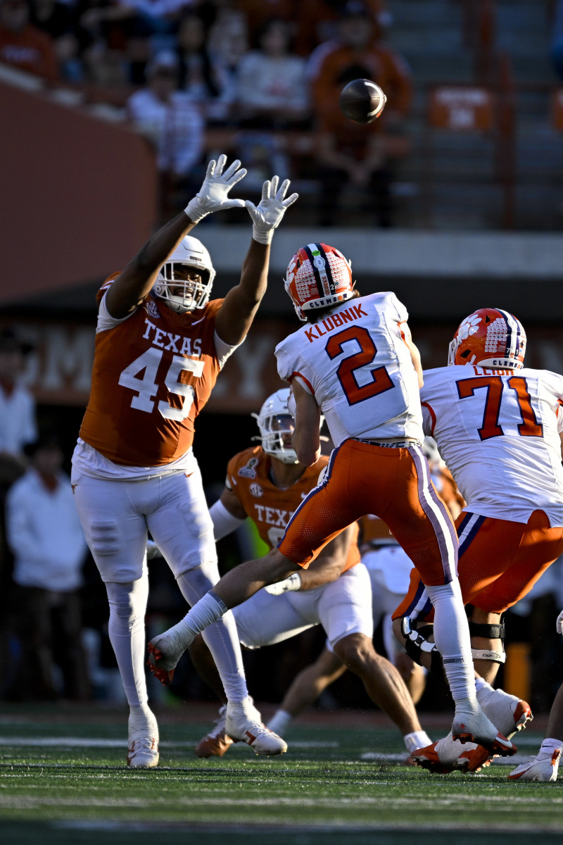 Clemson Tigers quarterback Cade Klubnik (2) is pressured by Texas Longhorns defensive lineman Vernon Broughton (45). Mandatory Credit: Jerome Miron-Imagn Images
