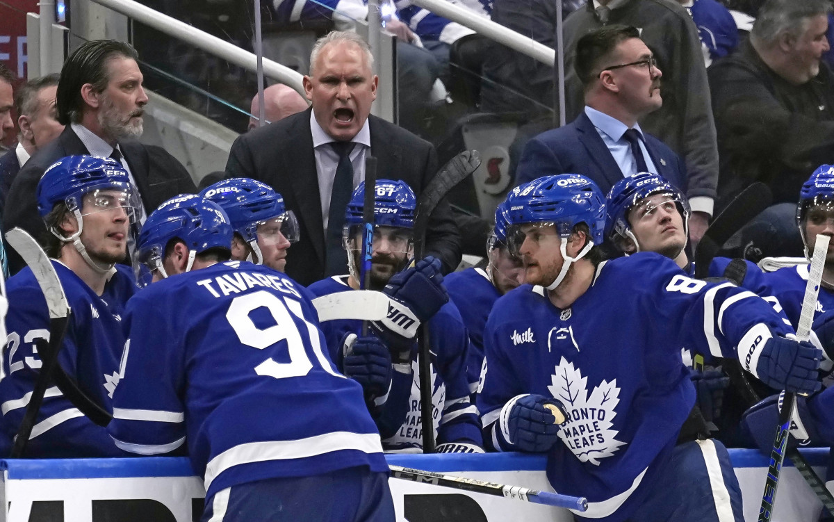 Toronto Maple Leafs head coach Craig Berube (center) talks to his players after a Florida Panthers goal during the third period of Game 1 of the second round of the 2025 Stanley Cup Playoffs at Scotiabank Arena.