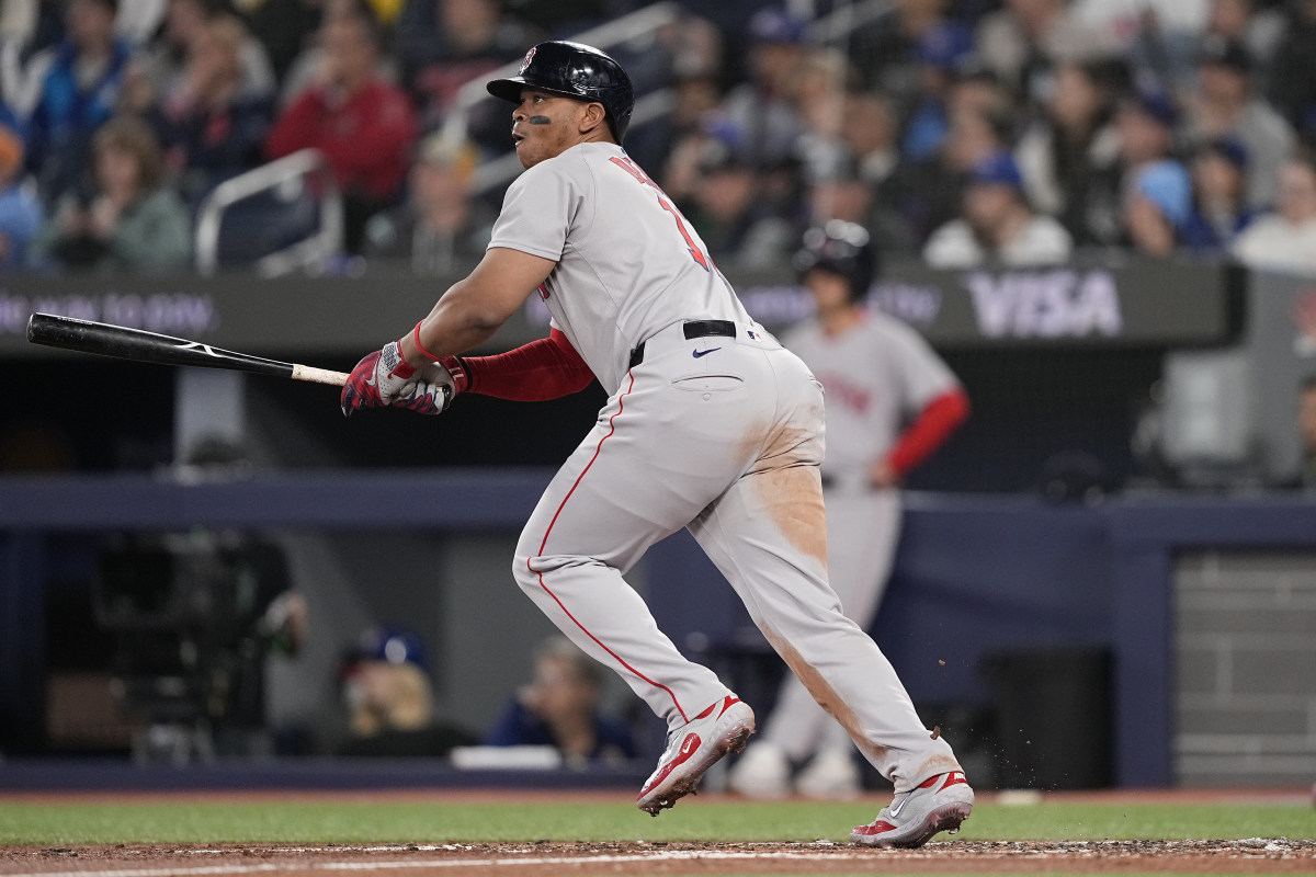 Boston Red Sox designated hitter Rafael Devers (11) hits a one-run double against the Toronto Blue Jays during the second inning at Rogers Centre.