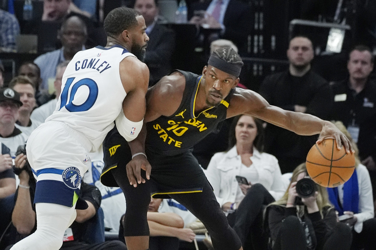 May 6, 2025; Minneapolis, Minnesota, USA; Minnesota Timberwolves guard Mike Conley (10) defends against Golden State Warriors forward Jimmy Butler (10) in the first quarter during game one of the second round for the 2025 NBA Playoffs at Target Center. Mandatory Credit: Bruce Kluckhohn-Imagn Images 