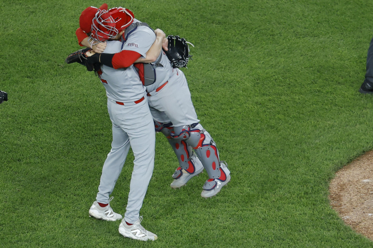 Cardinals pitcher Erick Fedde (12) celebrates with catcher Pedro Pagés (43) after throwing a complete game shutout.
