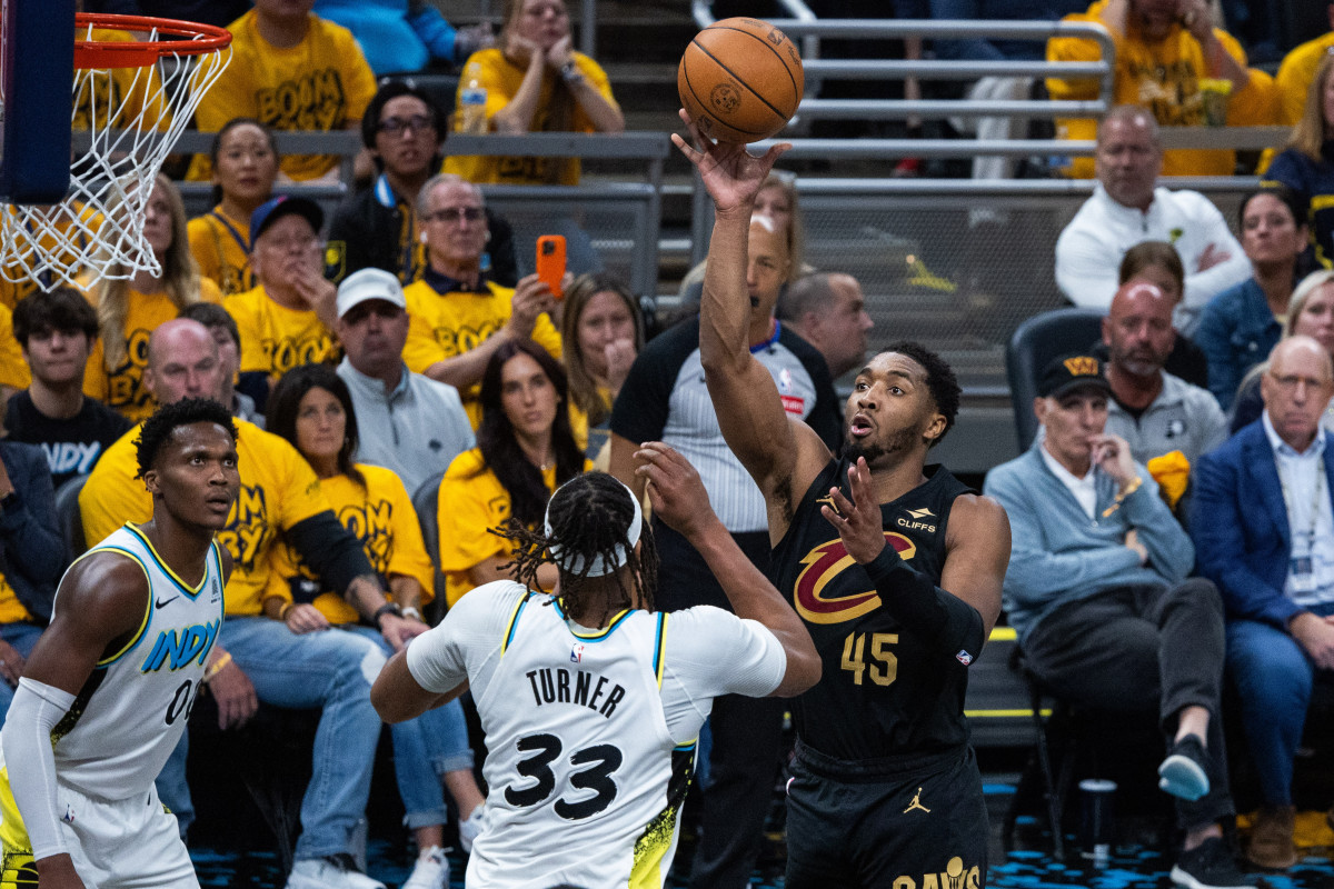 Cleveland Cavaliers guard Donovan Mitchell shoots over Indiana Pacers center Myles Turner.
