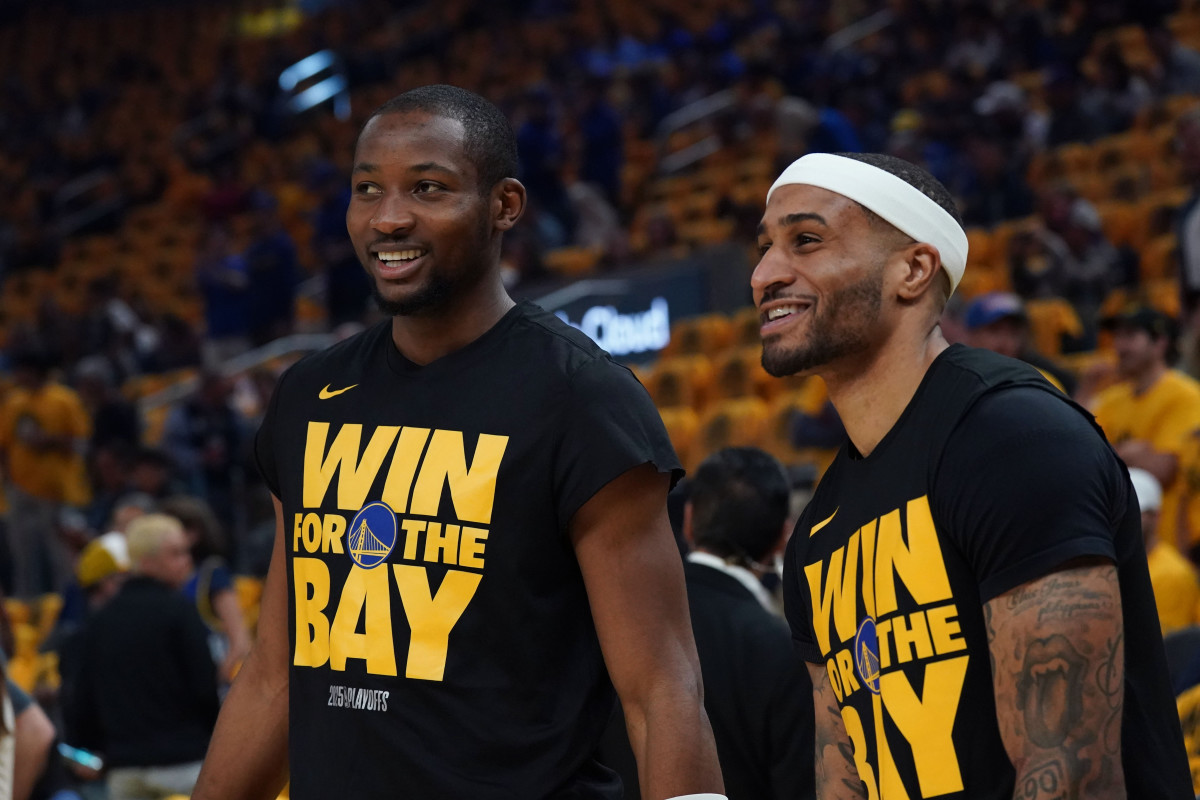 May 10, 2025; San Francisco, California, USA; Golden State Warriors forward Jonathan Kuminga (00) and guard Gary Payton II (0) warm up before game three of the second round for the 2025 NBA Playoffs against the Minnesota Timberwolves at Chase Center. Mandatory Credit: David Gonzales-Imagn Images  