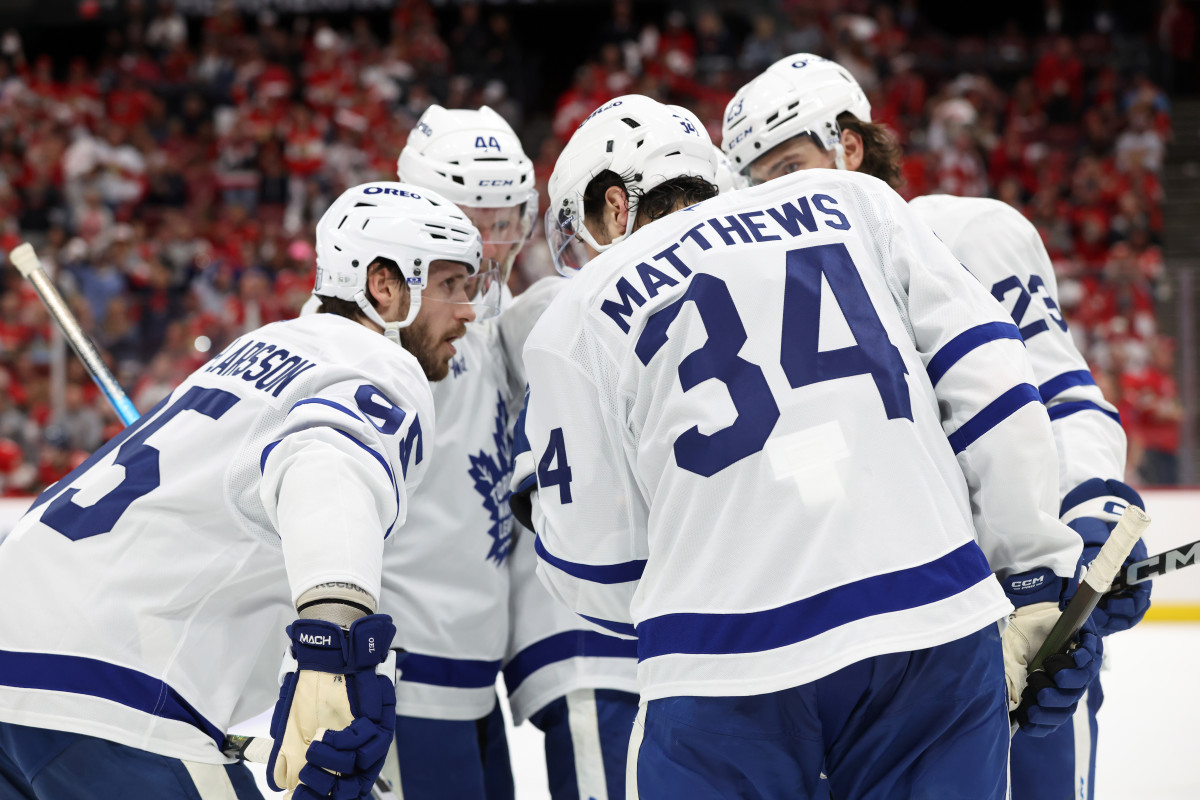 Maple Leafs center Auston Matthews (34) talks with Oliver Ekman-Larsson (95), Morgan Rielly (44), Matthew Knies (23) and Mitch Marner (16) against the Panthers.