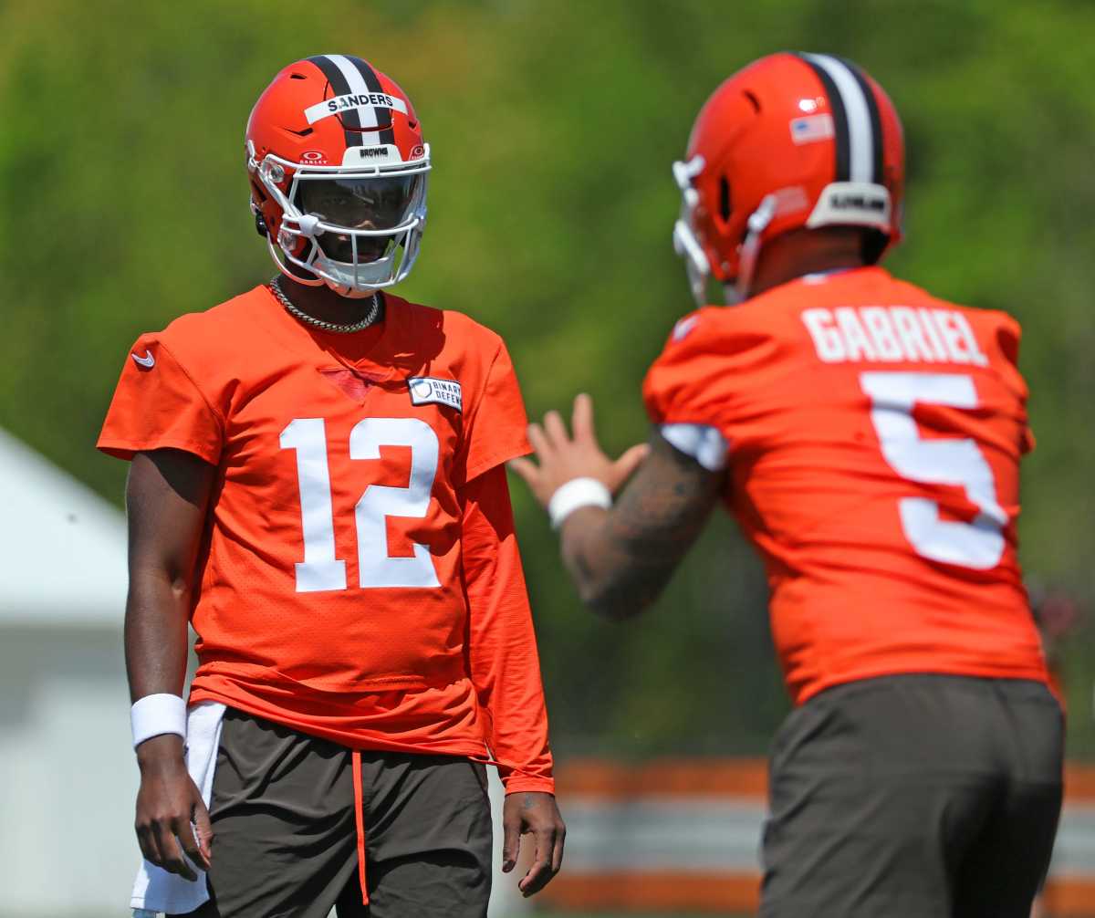 Cleveland Browns quarterback Shedeur Sanders (12) and quarterback Dillon Gabriel (5)