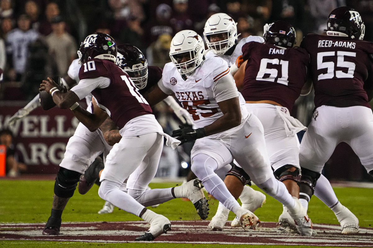 Texas Longhorns defensive tackle Vernon Broughton (45) pressures Texas A&M quarterback Marcel Reed (10). Mandatory Credit: Sara Diggins/USA TODAY Network via Imagn Images