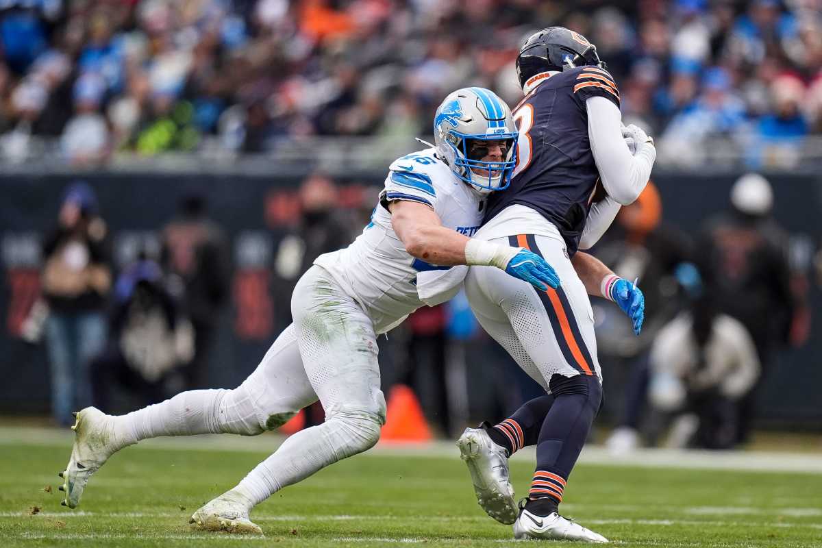 Detroit Lions linebacker Jack Campbell tackling Keenan Allen