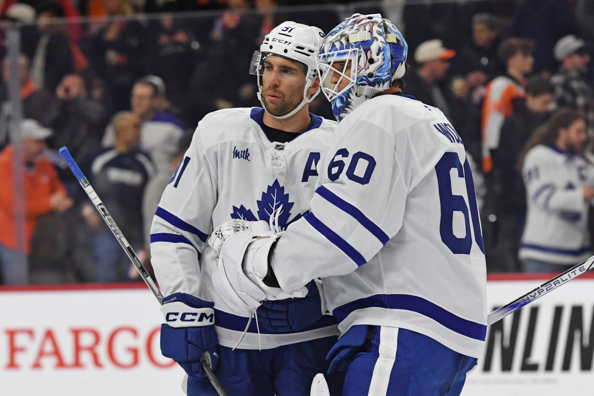 Toronto Maple Leafs center John Tavares (91) and goaltender Joseph Woll (60) celebrate a win.