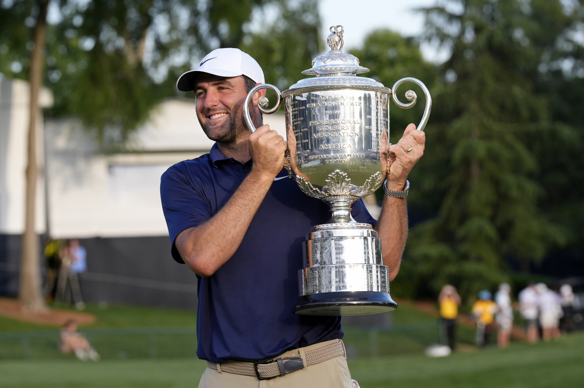 Scottie Scheffler holds the Wanamaker Trophy after winning the 2025 PGA Championship.