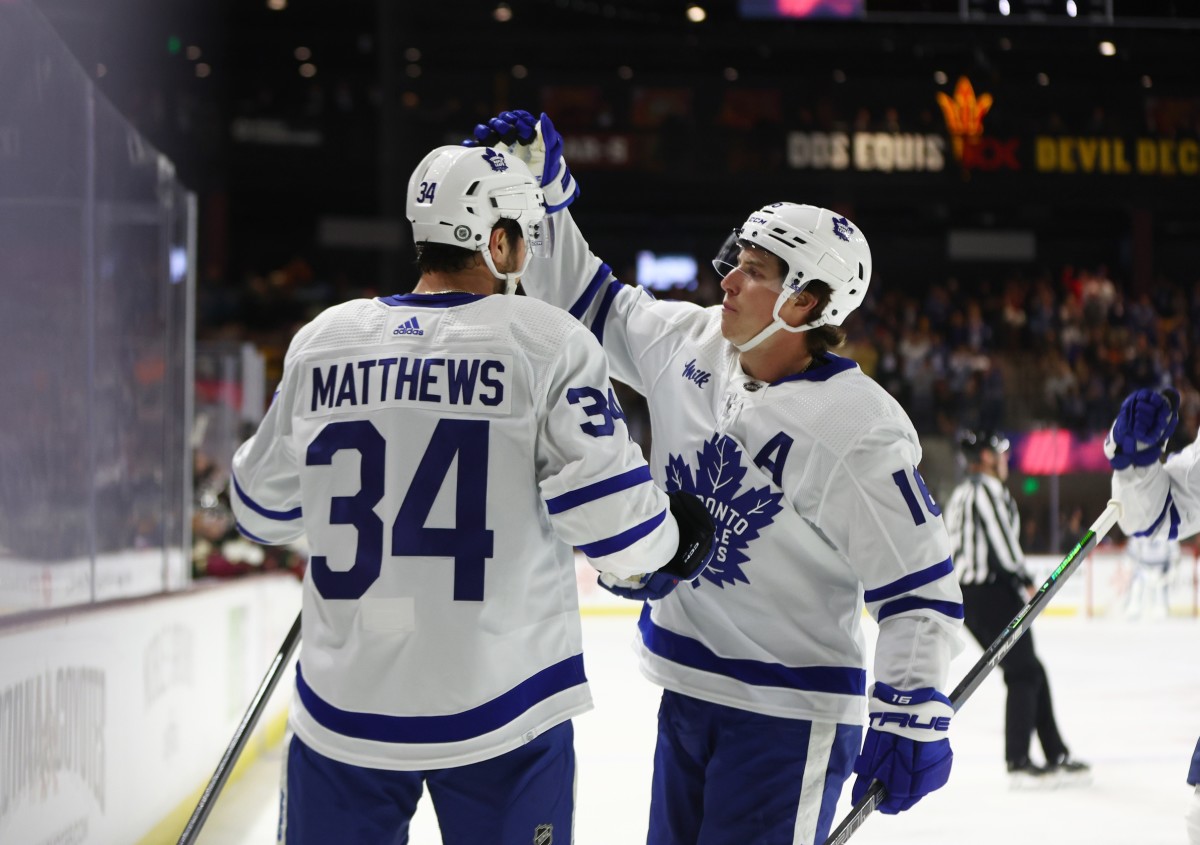 Toronto Maple Leafs center Auston Matthews (34) celebrates with forward Mitch Marner (16) after scoring a goal during the first period against the Arizona Coyotes at Mullett Arena.