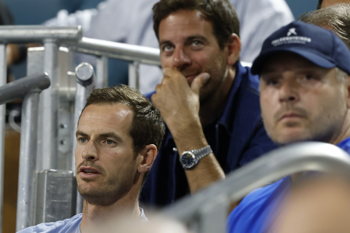 Andy Murray (left), coach of Novak Djokovic (not pictured), looks on in front of Juan Martin del Potro.