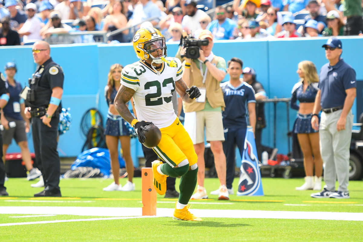 Green Bay Packers CB Jaire Alexander (23) scores on a pick six thrown by Tennessee Titans QB Will Levis (8)