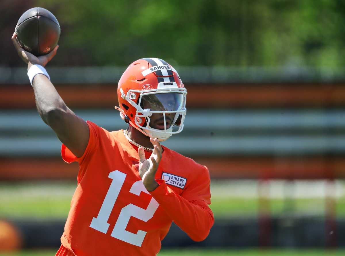 Shedeur Sanders throwing pass at Cleveland Browns OTAs; Cleveland Browns rookie quarterback Shedeur Sanders at training camp; Colorado Buffaloes QB Shedeur Sanders in Browns uniform; Shedeur Sanders competing for Browns backup quarterback role