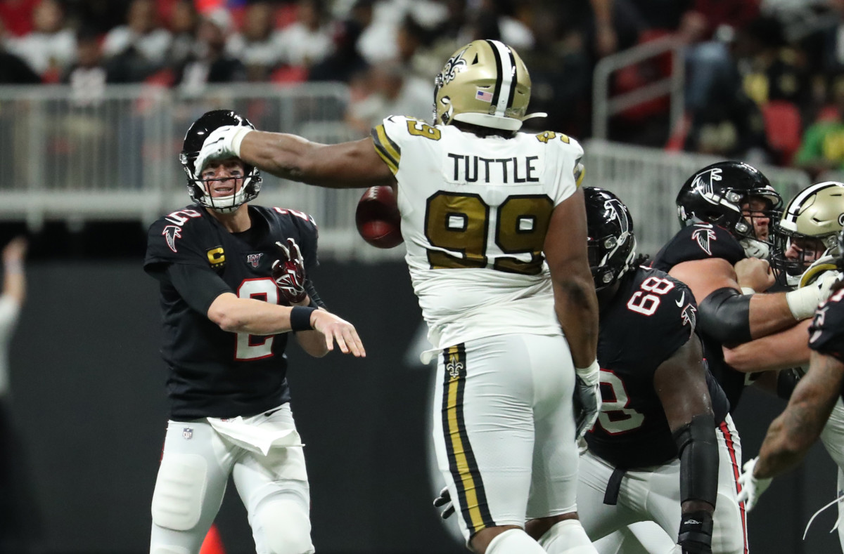 Nov 28, 2019; Atlanta Falcons quarterback Matt Ryan (2) throws an interception to New Orleans Saints defensive tackle Shy Tuttle (99). Mandatory Credit: Jason Getz-Imagn Images