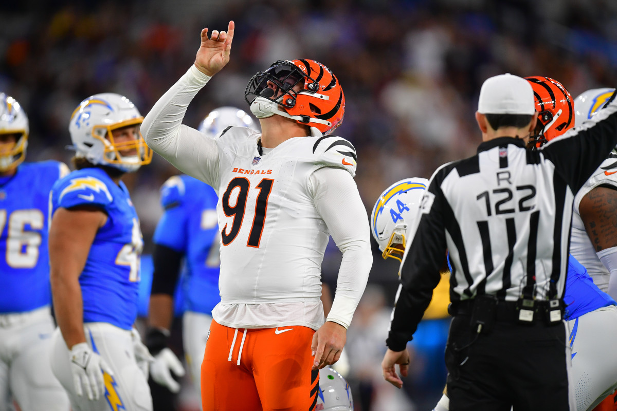 Cincinnati Bengals defensive end Trey Hendrickson (91) reacts after sacking Los Angeles Chargers quarterback Justin Herbert (10) during the first half at SoFi Stadium.
