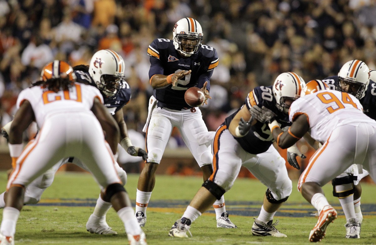 Auburn Tigers quarterback Cam Newton (2) takes a snap during the second half against the Clemson Tigers at Jordan Hare Stadium in Auburn. Auburn beat Clemson 27-24 in overtime.
