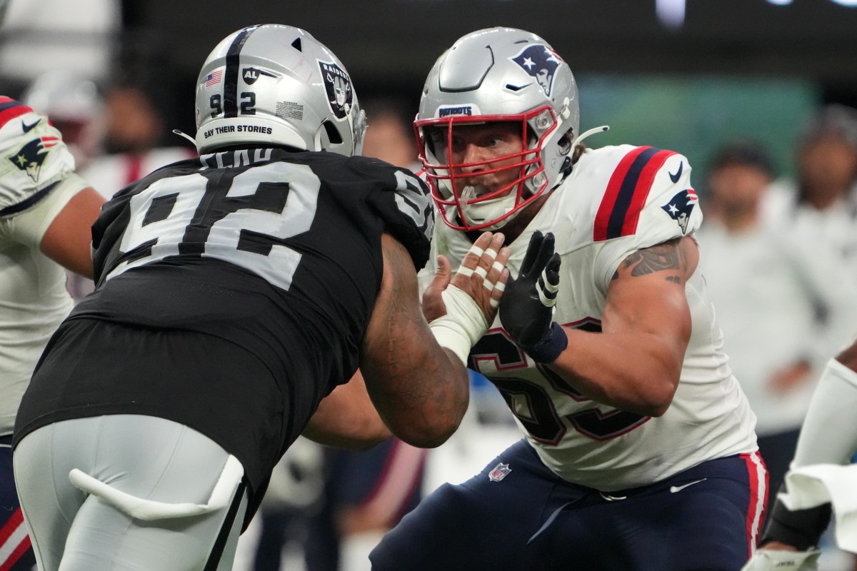 New England Patriots guard Cole Strange (69) defends against Las Vegas Raiders defensive tackle Kyle Peko (92) at Allegiant Stadium.