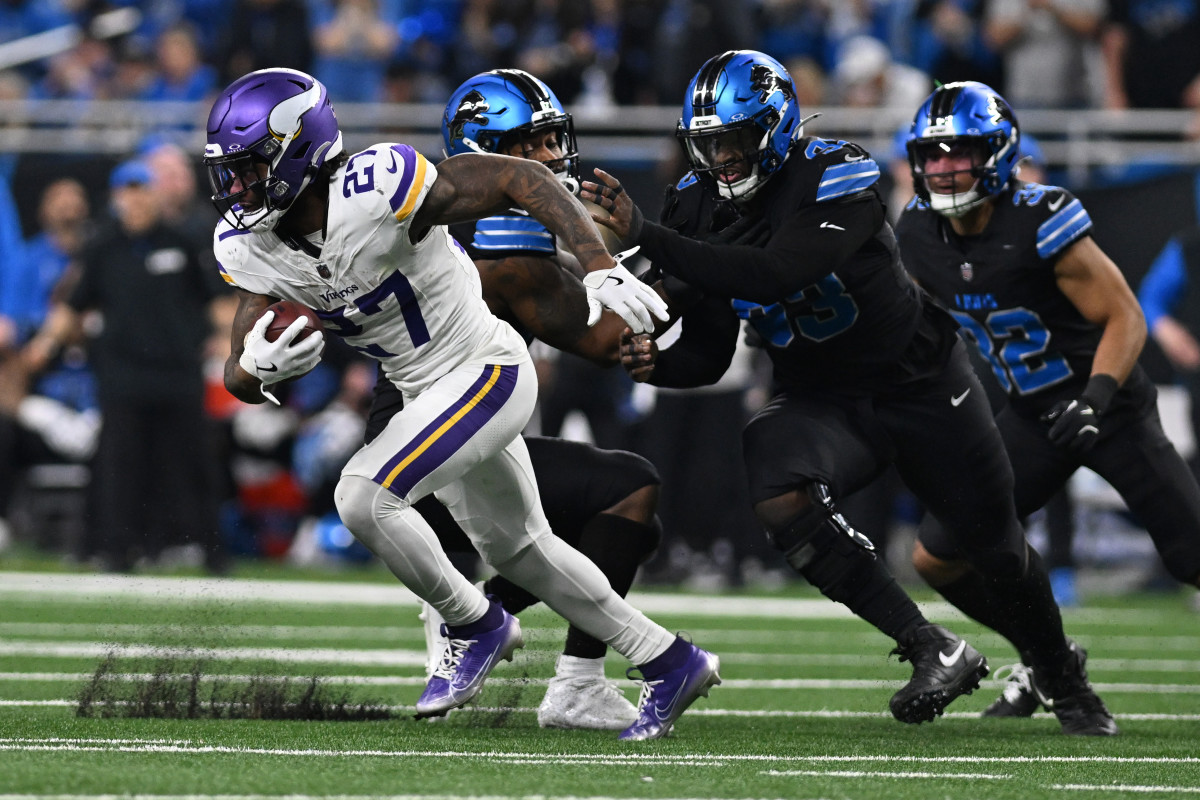 Minnesota Vikings running back Cam Akers (27) runs the ball against the Detroit Lions. Mandatory Credit: Lon Horwedel-Imagn Images