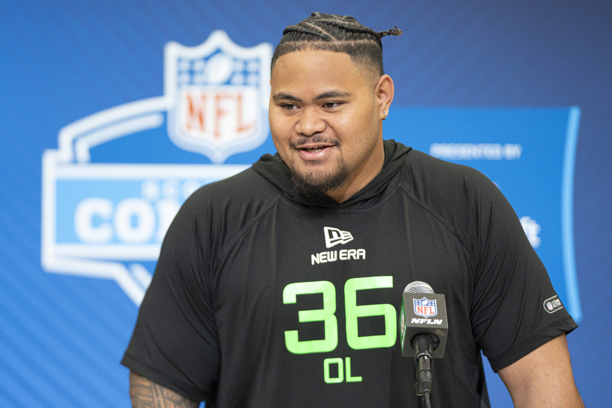 University of Arizona offensive lineman Jonah Savaiinaea (OL36) answers questions at a press conference during the 2025 NFL Combine at Indiana Convention Center.