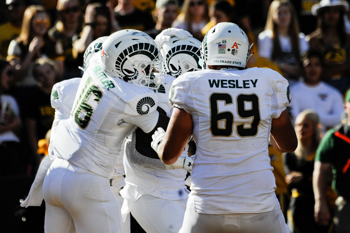 Sep 25, 2021; Iowa City, Iowa, USA; Colorado State Rams offensive lineman Barry Wesley (69) and tight end Cameron Butler (16) react with tight end Gary Williams (middle) after Williams scored on a 3 yard touchdown pass against the Iowa Hawkeyes during the second quarter at Kinnick Stadium. Mandatory Credit: Jeffrey Becker-Imagn Images  