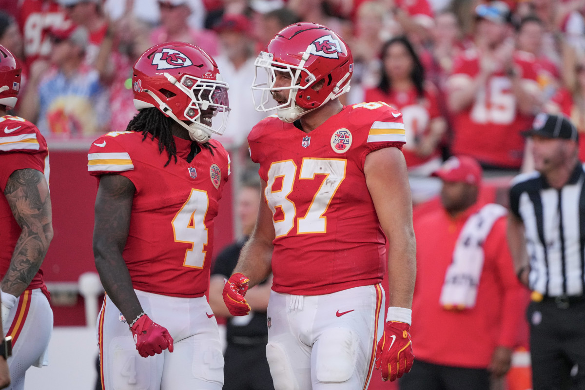 Kansas City Chiefs tight end Travis Kelce (87) celebrates with wide receiver Rashee Rice (4)