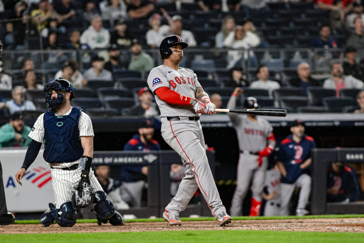 Jun 8, 2025; Bronx, New York, USA; Boston Red Sox designated hitter Rafael Devers (11) reacts after hitting a solo home run against the New York Yankees during the ninth inning at Yankee Stadium.