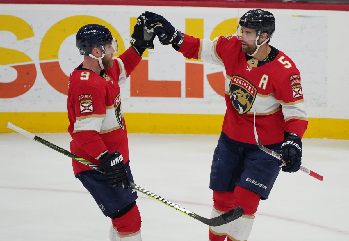 Florida Panthers defenseman Aaron Ekblad (5) celebrates a goal with center Sam Bennett (9) in the second period against the Montreal Canadiens at FLA Live Arena. 
