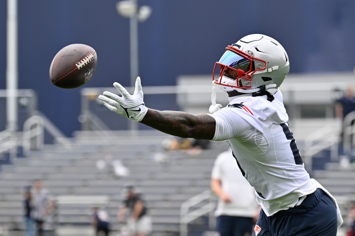 New England Patriots wide receiver Stefon Diggs (8) has the ball sail past his grip during minicamp at Gillette Stadium.