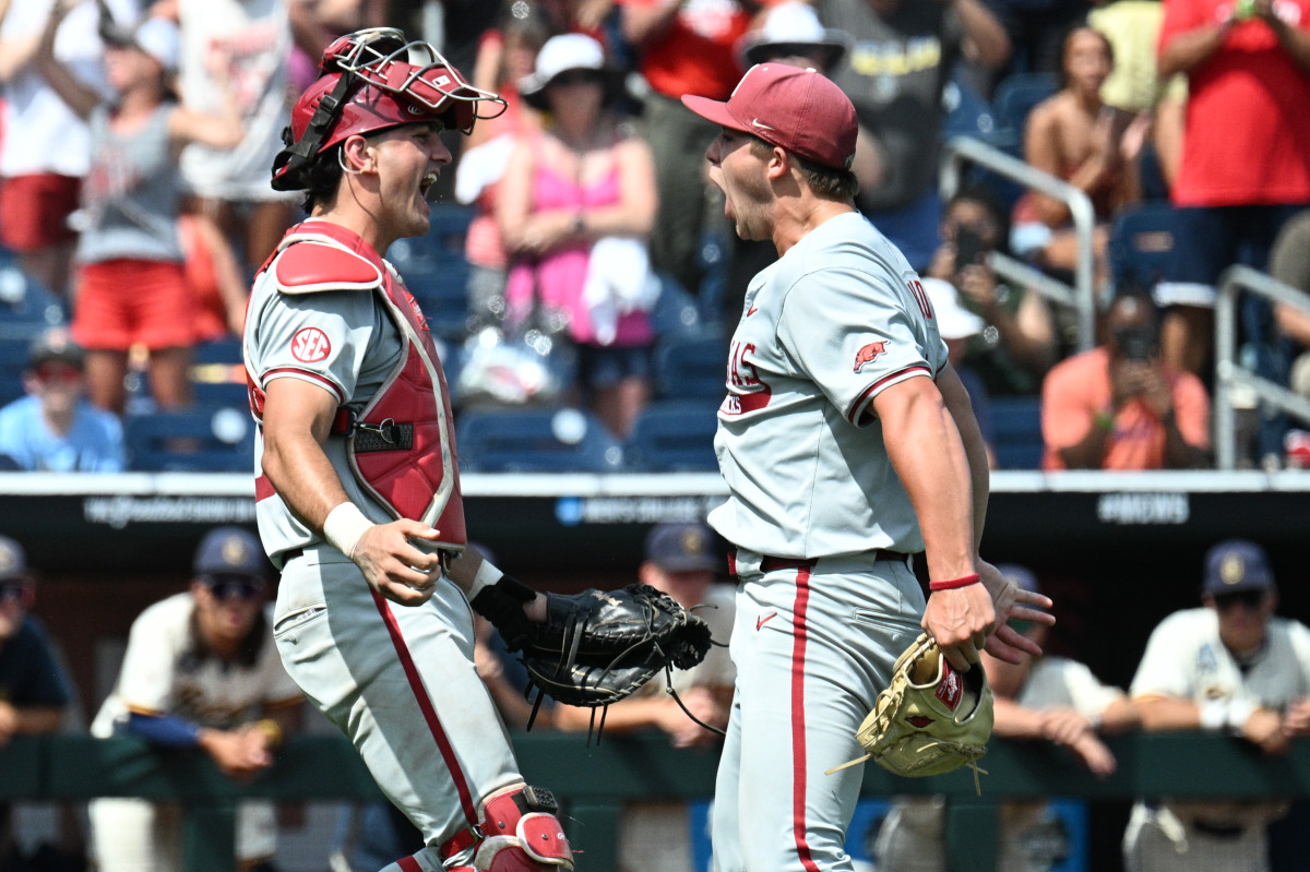 Arkansas Razorbacks starting pitcher Gage Wood (14) celebrates with catcher Ryder Helfrick (27) after completing a no hitter against the Murray State Racers at Charles Schwab Field.