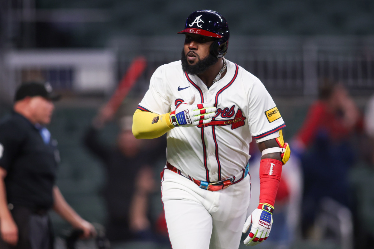 Atlanta Braves designated hitter Marcell Ozuna (20) celebrates after a walk-off two-run home run against the Philadelphia Phillies in the eleventh inning at Truist Park.