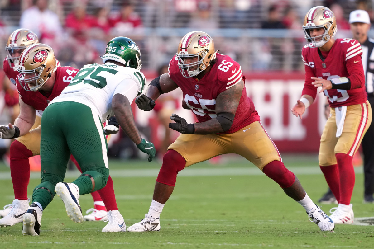 Former San Francisco 49ers guard Aaron Banks (65) blocks New York Jets defensive tackle Quinnen Williams