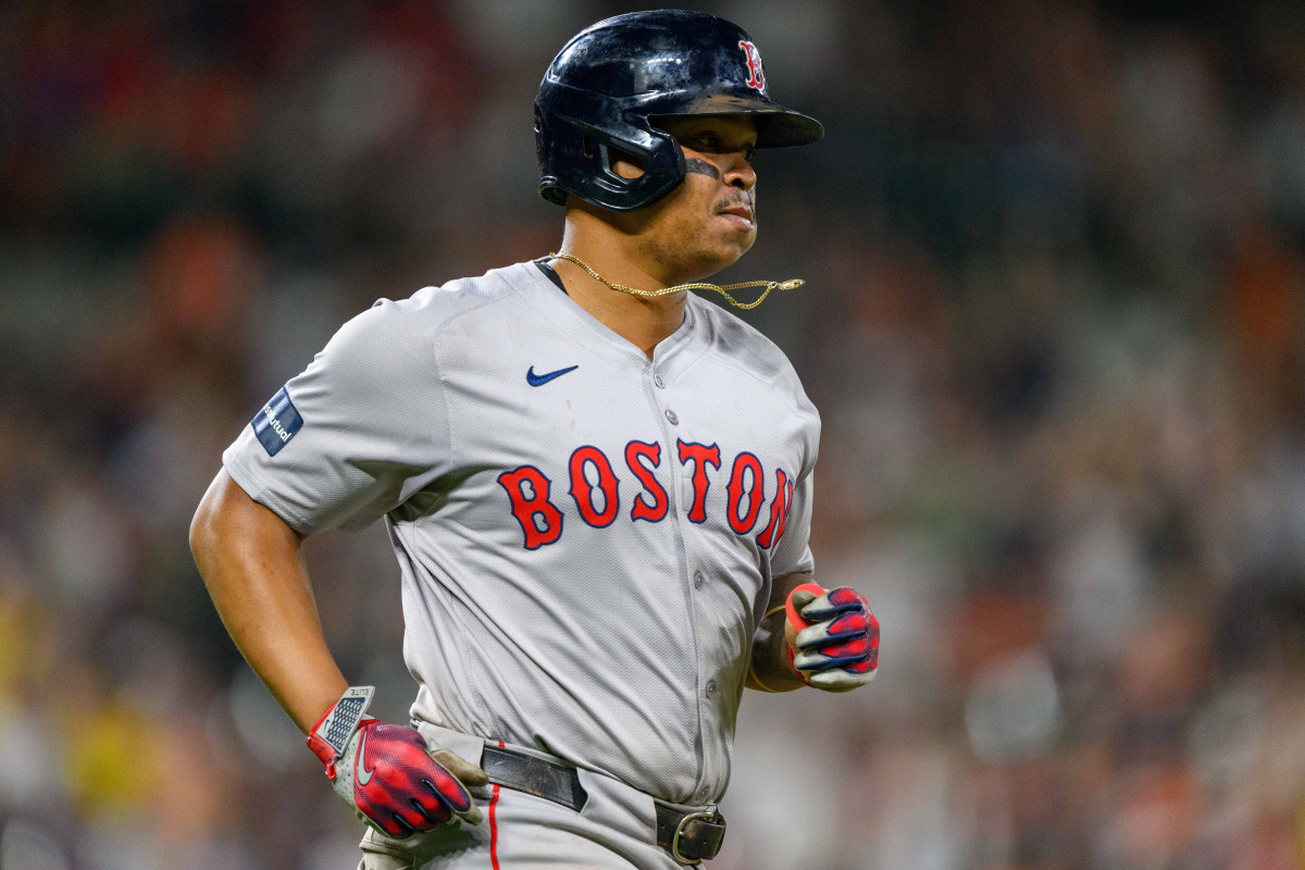 Boston Red Sox third baseman Rafael Devers (11) runs to first base after hitting a home run during the eighth inning against the Baltimore Orioles at Oriole Park at Camden Yards.