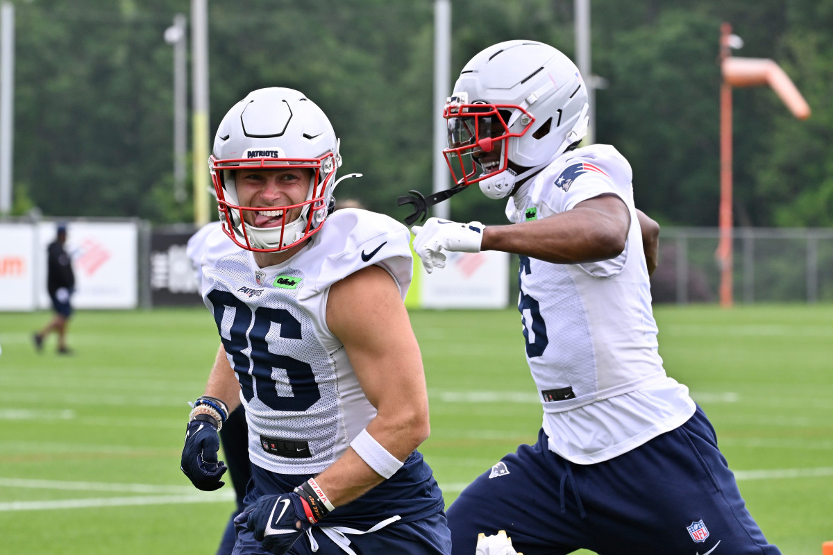 New England Patriots wide receiver Efton Chism III (86) reacts to beating wide receiver Javon Baker (6) in a drill during minicamp at Gillette Stadium.