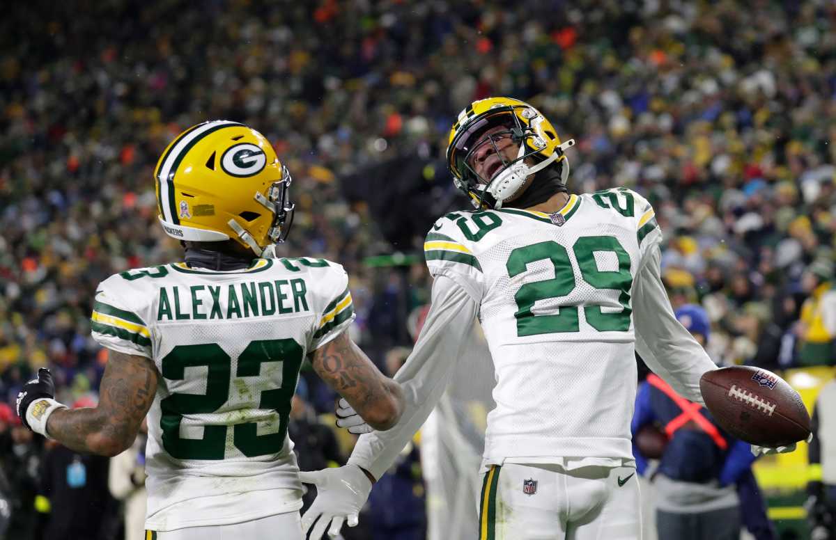 Green Bay Packers cornerback Rasul Douglas celebrates interception with former Packers cornerback Jaire Alexander.