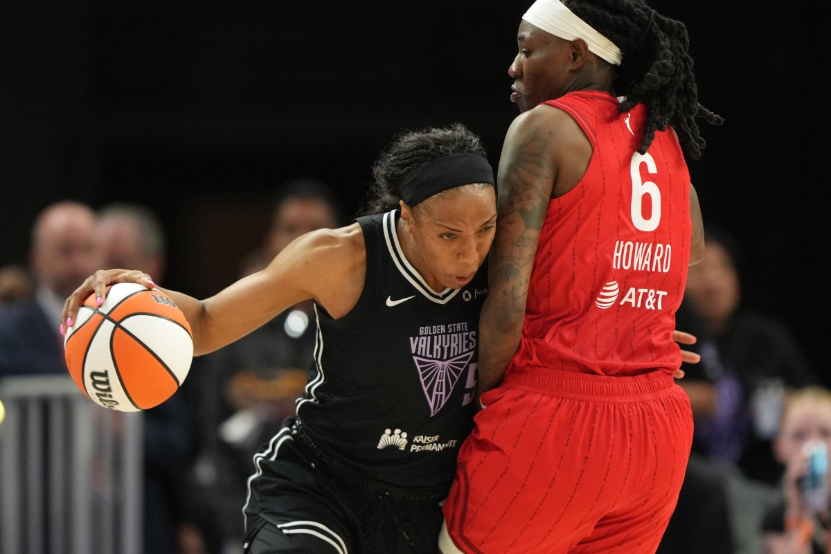 Golden State Valkyries forward Kayla Thornton (left) dribbles against Indiana Fever forward Natasha Howard (6).