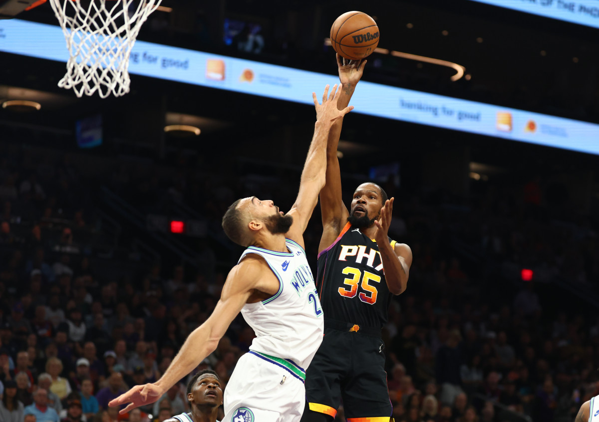 Phoenix Suns forward Kevin Durant (35) shoots the ball against Minnesota Timberwolves center Rudy Gobert (27) in the first half at Footprint Center.