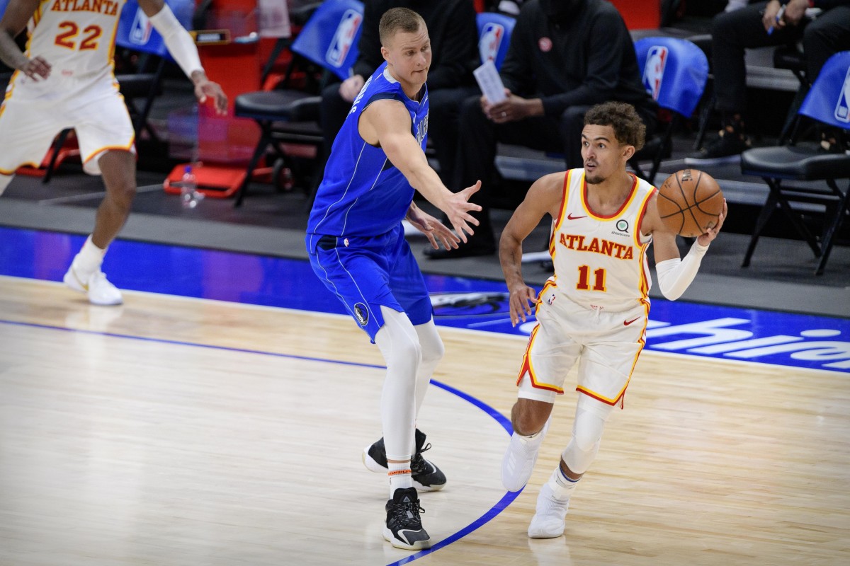Trae Young's Immediate Reaction to Kristaps Porzingis Trade - Athlon Sports