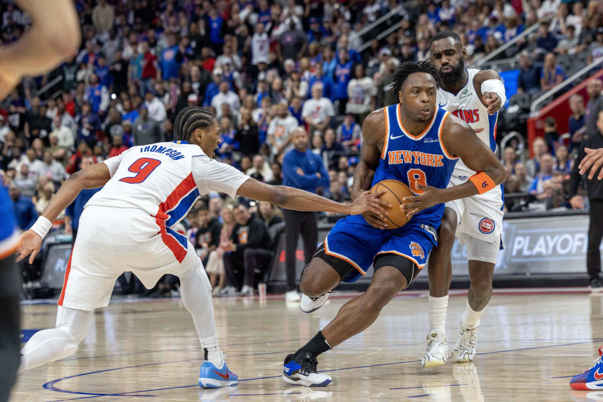New York Knicks forward OG Anunoby (8) drives to the basket between Detroit Pistons forward Ausar Thompson (9) and forward Tim Hardaway Jr. (8) during the second quarter of game four of first round for the 2025 NBA Playoffs at Little Caesars Arena.
