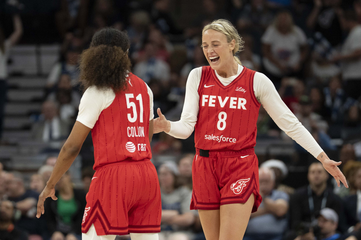 Indiana Fever guard Sophie Cunningham (8) celebrates with teammate Sydney Colson (51) after defeating the Minnesota Lynx during the Commissioner's Cup final at Target Center.