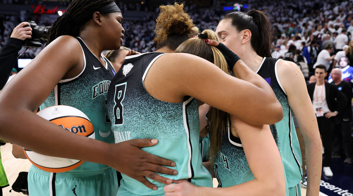 New York Liberty players celebrate their team’s win over the Minnesota Lynx in Game 3 of the WNBA Finals at Target Center on Oct. 16, 2024.