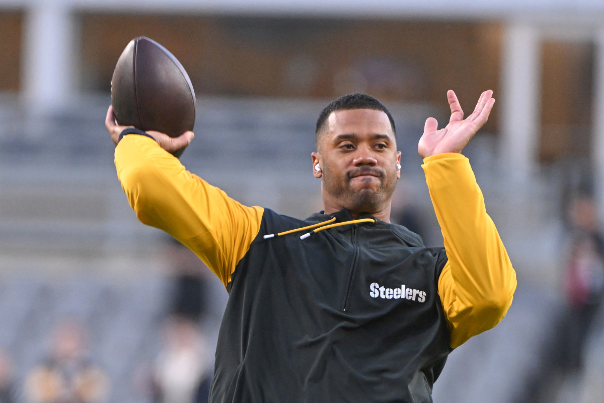 Russell Wilson (3) warms up for a game against the New York Jets at Acrisure Stadium.