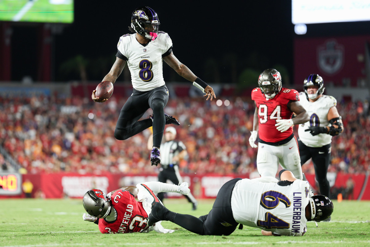 Baltimore Ravens quarterback Lamar Jackson (8) runs with the ball against the Tampa Bay Buccaneers in the second quarter at Raymond James Stadium. Mandatory Credit: Nathan Ray Seebeck-Imagn Images