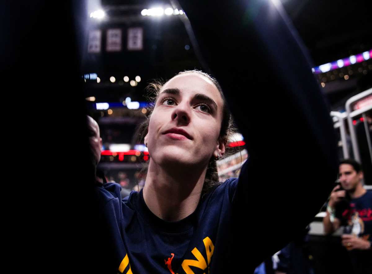 Indiana Fever guard Caitlin Clark (22) signs merchandise Friday, Sept. 6, 2024, during a game between the Indiana Fever and the Minnesota Lynx at Gainbride Fieldhouse in Indianapolis.