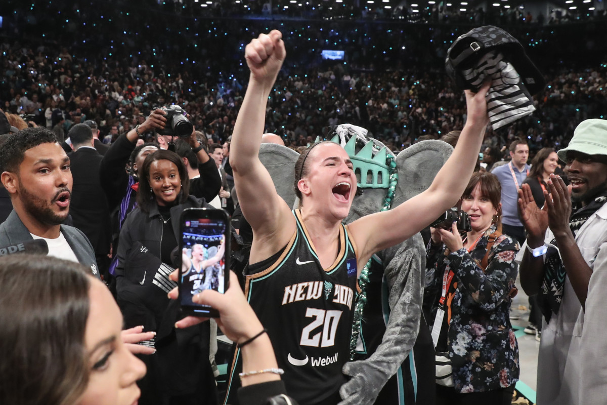 New York Liberty guard Sabrina Ionescu celebrates after winning the 2024 WNBA Finals.