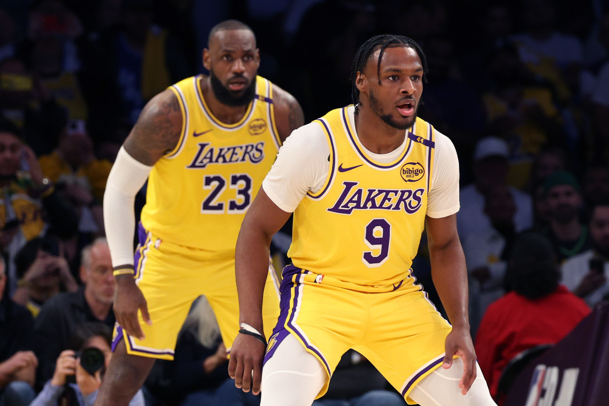 LeBron James and Bronny James of the Los Angeles Lakers defend during their game against the Minnesota Timberwolves at Crypto.com Arena on October 22, 2024.