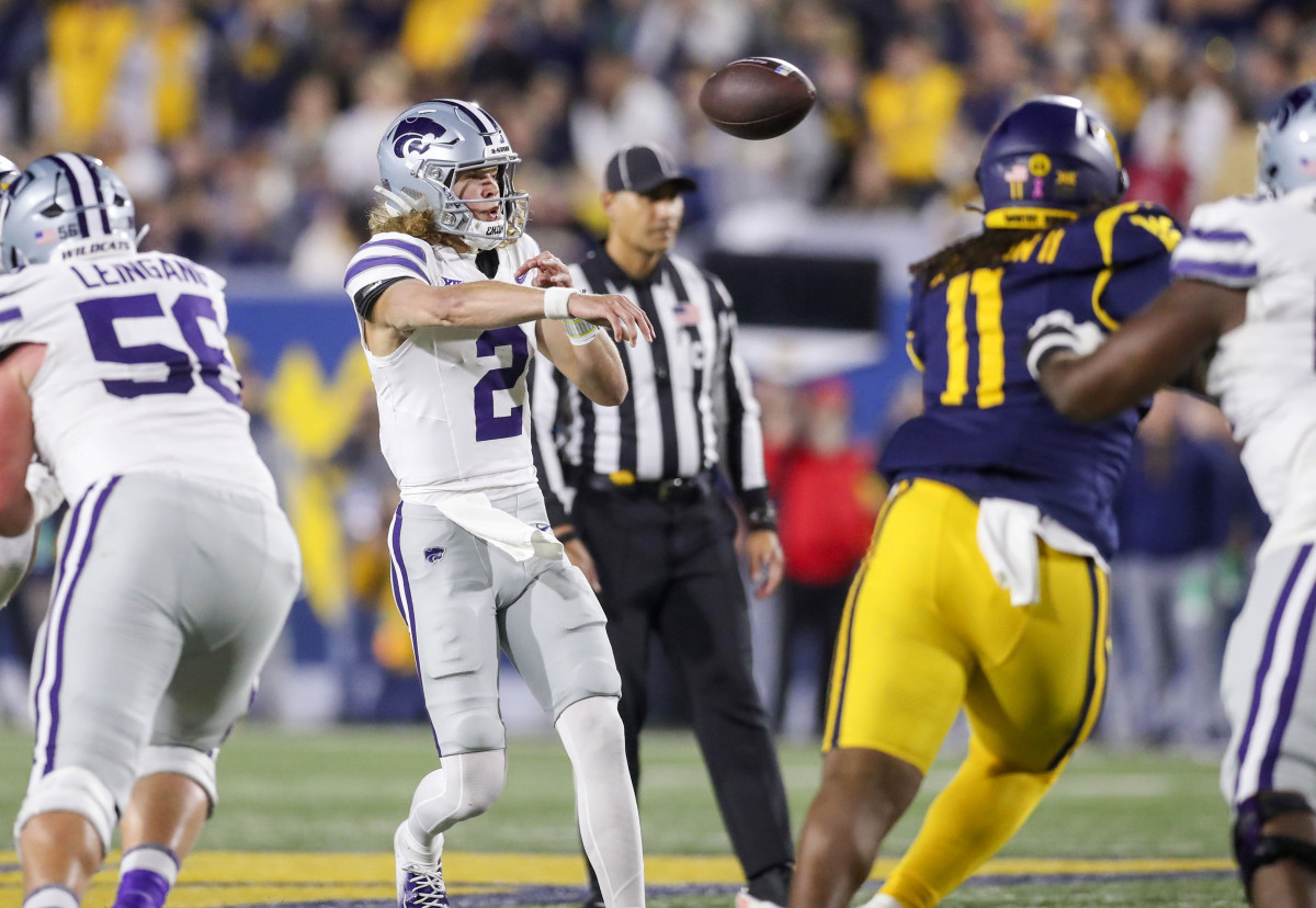 Oct 19, 2024; Morgantown, West Virginia, USA; Kansas State Wildcats quarterback Avery Johnson (2) throws a pass during the first quarter against the West Virginia Mountaineers at Mountaineer Field at Milan Puskar Stadium.