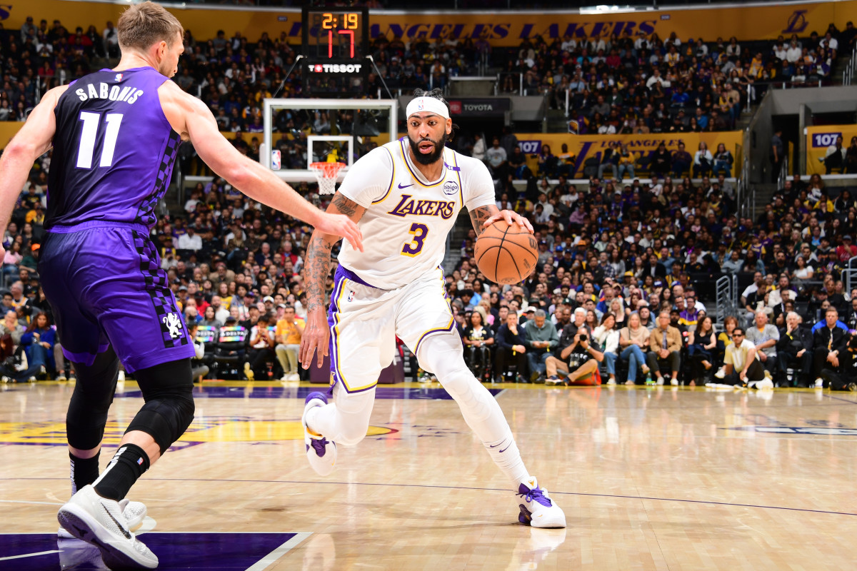 Los Angeles Lakers forward Anthony Davis dribbles the ball as Sacramento Kings center Domantas Sabonis defends on Oct. 26, 2024, at Crypto.Com Arena.